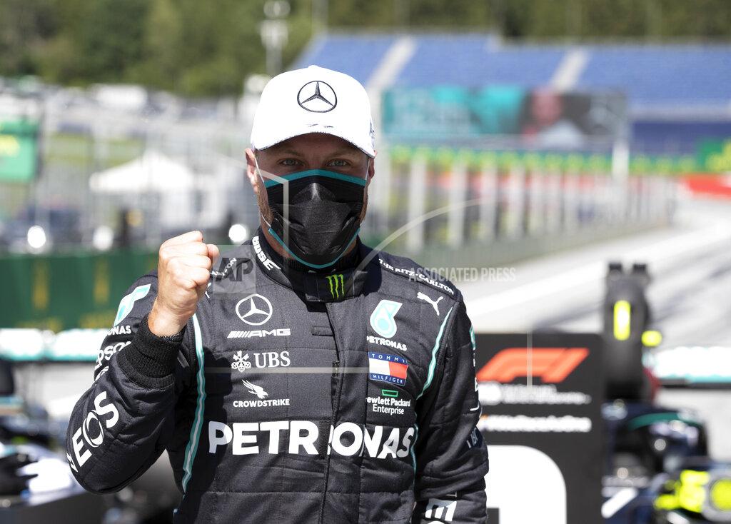 Mark Thompson Mercedes driver Valtteri Bottas of Finland, wearing a mask against the spread of the coronavirus, celebrates after he clocked the fastest time during the qualifying session at the Red Bull Ring racetrack in Spielberg, Austria, Saturday, July 4, 2020. The Austrian Formula One Grand Prix will be held on Sunday. (Mark Thompson/Pool via AP)