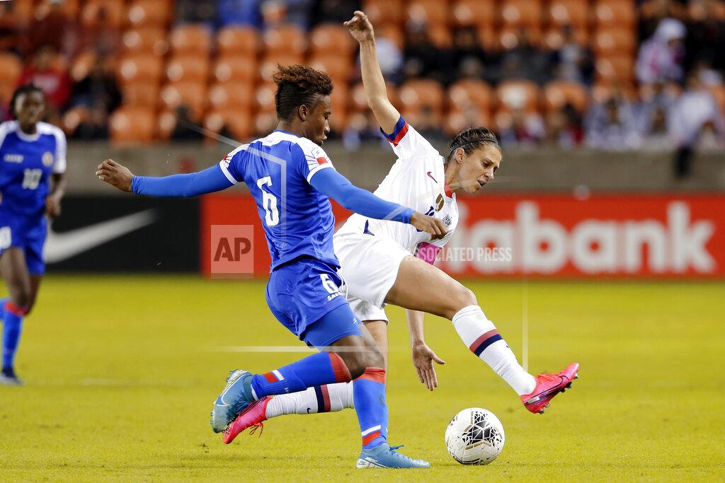 Michael Wyke Haiti midfielder Melchie Dumonay (6) tries to move the ball past United States forward Carli Lloyd, right, during the second half of a women's Olympic qualifying soccer match Tuesday, Jan. 28, 2020, in Houston. (AP Photo/Michael Wyke)