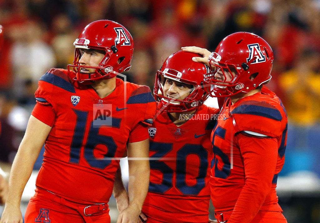 Rick Scuteri Arizona placekicker Josh Pollack (30) watches with Jake Glatting (16) and Rexx Tessler (55) a missed field goal that would of won an NCAA college football game against Arizona State, Saturday, Nov. 24, 2018, in Tucson, Ariz. Arizona State defeated Arizona to claim the Territorial Cup. (AP Photo/Rick Scuteri)
