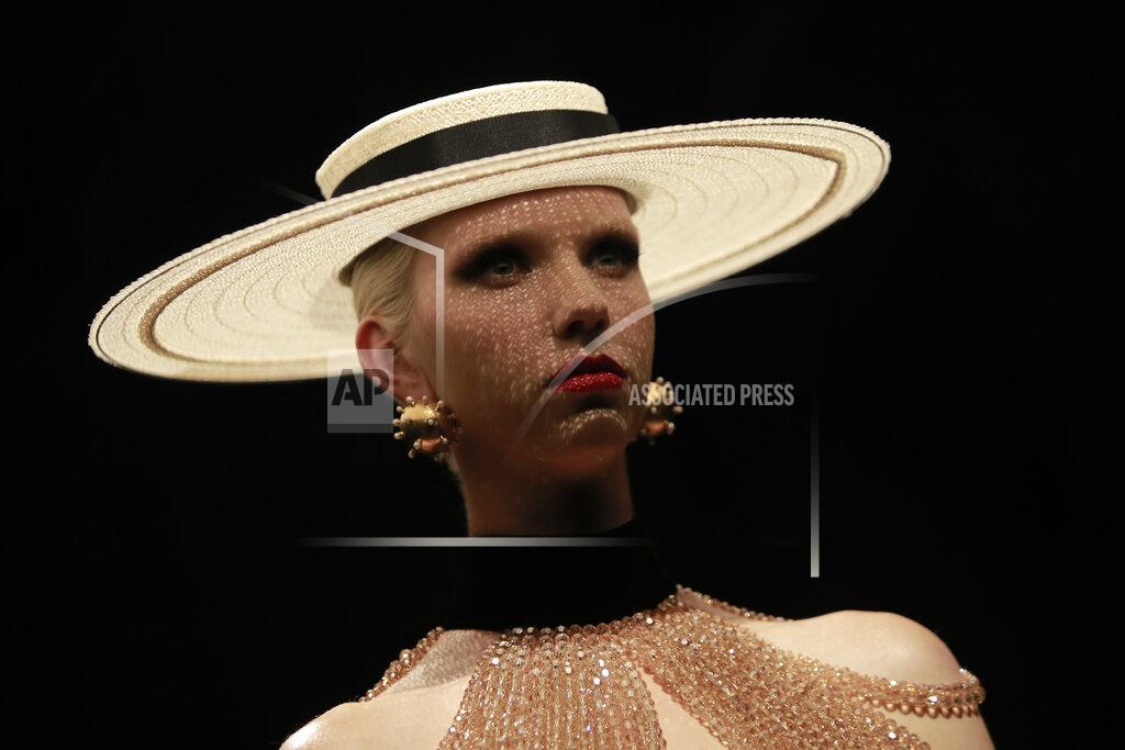 Lewis Joly A model wears a creation for Schiaparelli's Haute Couture Fall/Winter 2022-2023 fashion collection, Monday, July 4, 2022 in Paris. (AP Photo/Lewis Joly)