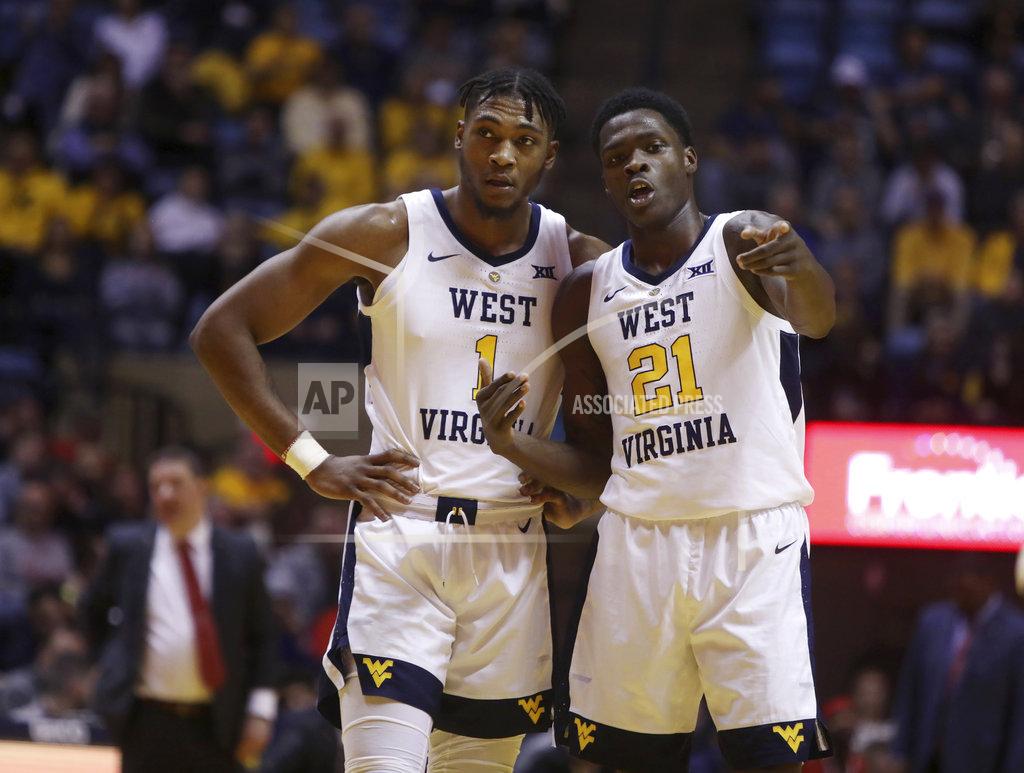 Ray Thompson West Virginia forward Derek Culver (1) and forward Wesley Harris (21) go over a play during the second half of an NCAA college basketball game against Texas Tech Wednesday, Jan. 2, 2019, in Morgantown, W.Va. Texas Tech defeated West Virginia 62-59. (AP Photo/Raymond Thompson)