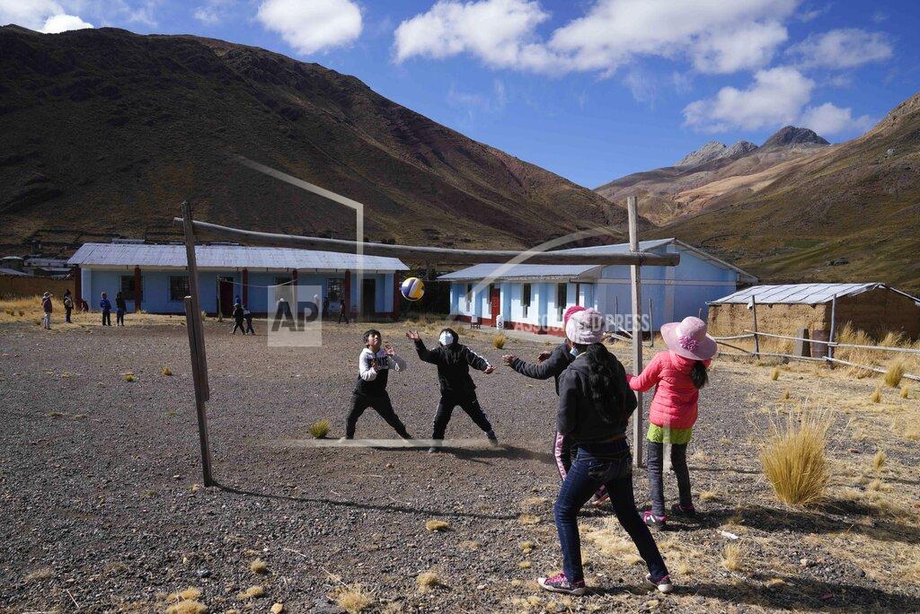 Martin Mejia Students play volleyball during recess at a bilingual public primary school in Licapa, Peru, Wednesday, Sept. 1, 2021. In 1975, a nationalist military government turned Quechua into an official language in Peru, along with Spanish, but legal recognition did not stop discrimination against Quechua speakers, who come mostly from poor and rural areas. (AP Photo/Martin Mejia)