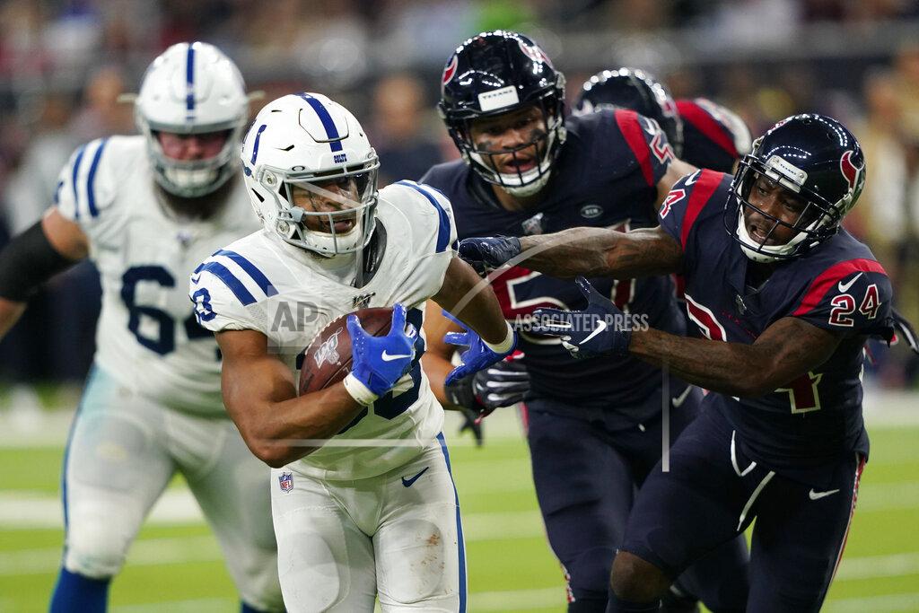 David J. Phillip Indianapolis Colts running back Jonathan Williams (33) pulls away from Houston Texans cornerback Johnathan Joseph (24) as he runs for a touchdown during the second half of an NFL football game Thursday, Nov. 21, 2019, in Houston. (AP Photo/David J. Phillip)