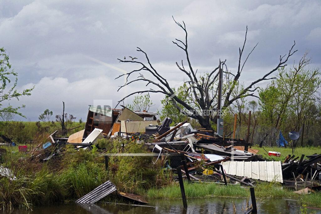 Gerald Herbert Storm clouds from Tropical Storm Nicholas are seen behind homes of the vanishing Native American community of Isle de Jean Charles, La., which were destroyed by Hurricane Ida, Tuesday, Sept. 14, 2021. (AP Photo/Gerald Herbert)