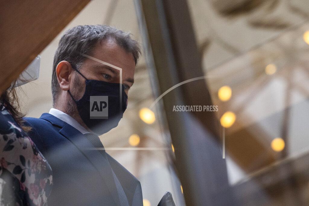 Slovakia's Prime Minister Igor Matovic arrives for a government meeting in Bratislava Friday, March 12, 2021. Two parties in Slovakia’s ruling coalition called Monday March 15, 2021, on populist prime minister Matovic to step down amidst a government crisis triggered two weeks ago by a secret deal to acquire Russia’s Sputnik V coronavirus vaccine, orchestrated by Matovic. (Jaroslav Novak/TASR via AP)