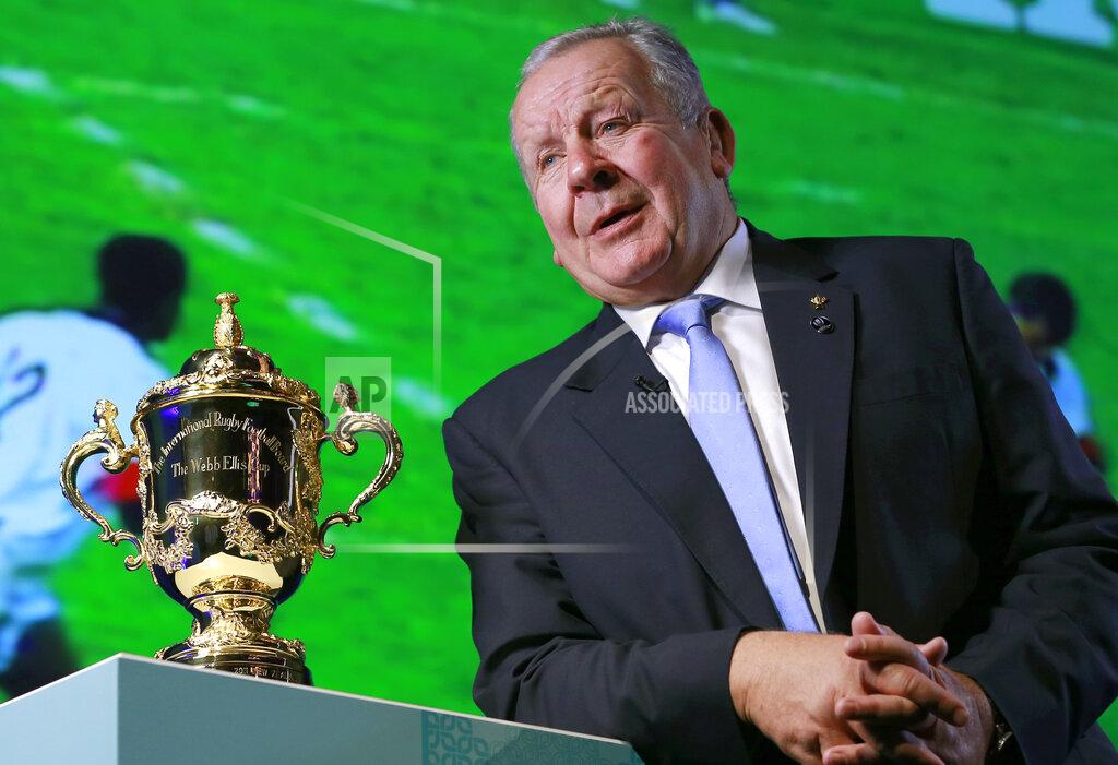 FILE - In this Thursday, Nov. 2, 2017 file photo, World Rugby Chairman Bill Beaumont speaks beside the Webb Ellis Cup during an interview before the match schedule announcement for the 2019 Rugby World Cup in Tokyo. Bill Beaumont and Agustin Pichot are vying to become chairman of World Rugby amid trying times for the sport because of the coronavirus outbreak and the growing discussion about a global calendar to unify the international game. (AP Photo/Shizuo Kambayashi, File)