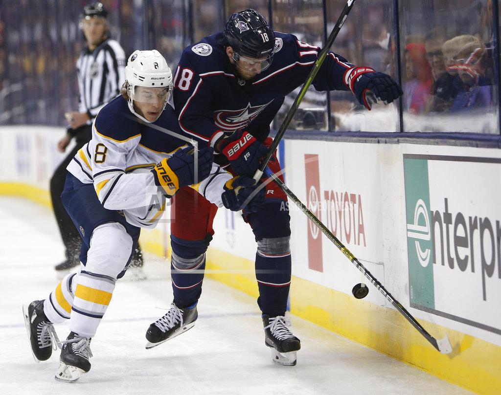 Jay Laprete Buffalo Sabres' Casey Nelson, left, and Columbus Blue Jackets' Pierre-Luc Dubois chase a loose puck during the second period of an NHL hockey game Saturday, Oct. 27, 2018, in Columbus, Ohio. (AP Photo/Jay LaPrete)
