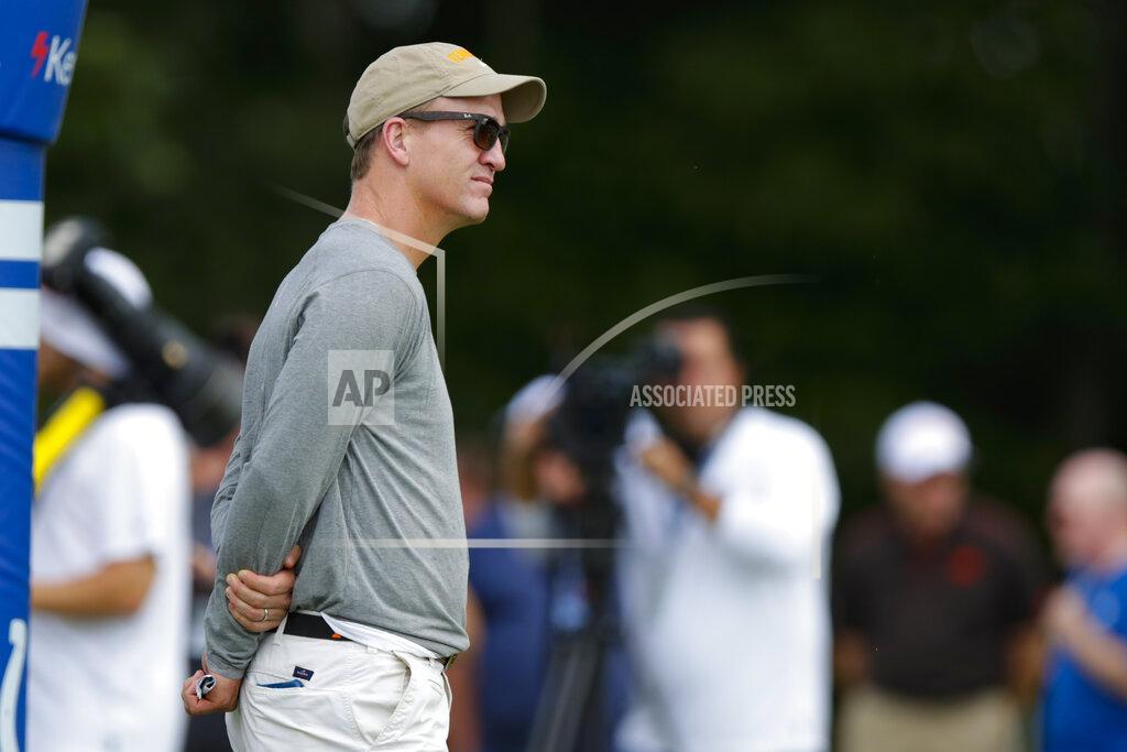 Michael Conroy Former Indianapolis Colts quarterback Peyton Manning watches a joint practice of the Cleveland Browns at the Colts' NFL football training camp in Westfield, Ind., Thursday, Aug. 15, 2019. (AP Photo/Michael Conroy)