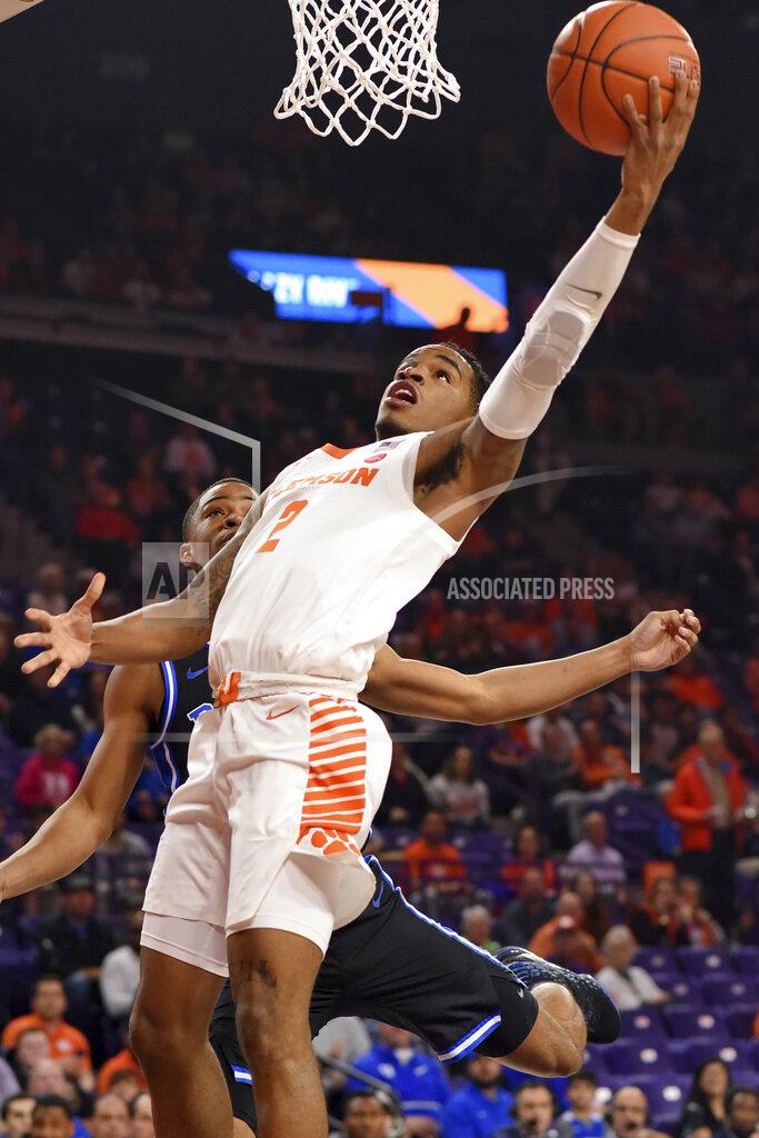 Richard Shiro Clemson's Al-Amir Dawes, front, shoots while defended by Duke's Cassius Stanley during the first half of an NCAA college basketball game against Duke Tuesday, Jan. 14, 2020, in Clemson, S.C. (AP Photo/Richard Shiro)