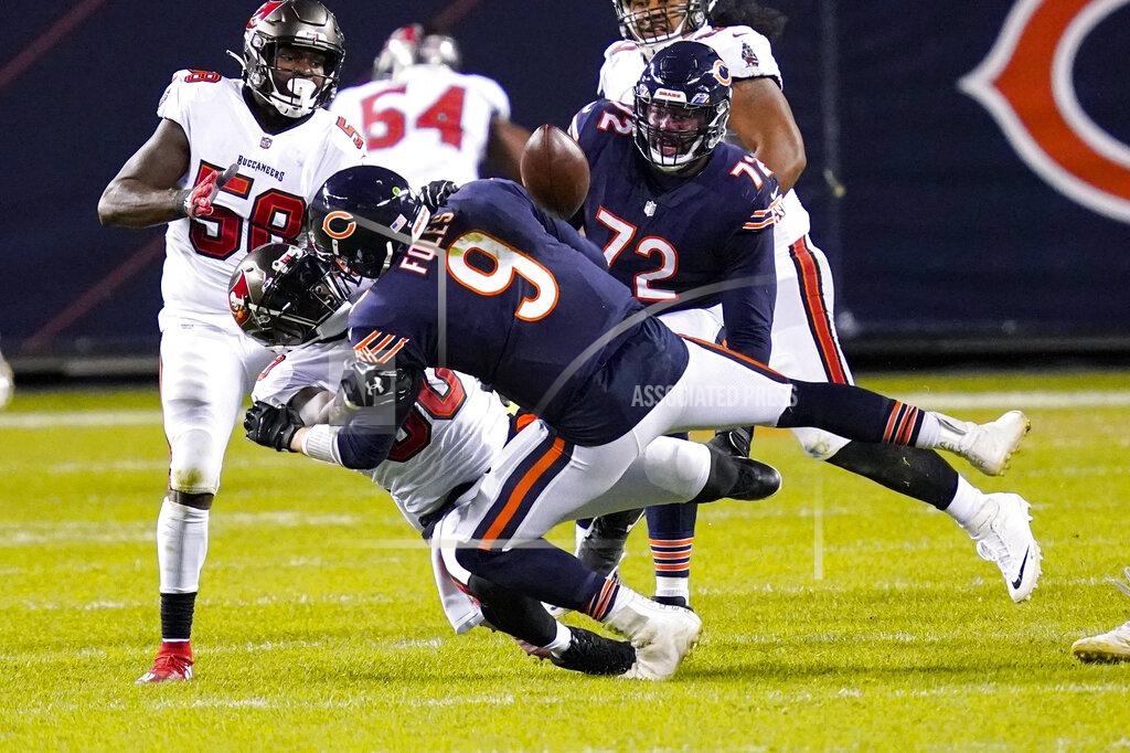 Charles Rex Arbogast Chicago Bears quarterback Nick Foles (9) fumbles the ball as he's sacked by Tampa Bay Buccaneers outside linebacker Jason Pierre-Paul (90) during the second half of an NFL football game in Chicago, Thursday, Oct. 8, 2020. The Bears recovered the fumble, (AP Photo/Charles Rex Arbogast)