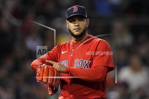 Boston Red Sox starting pitcher Eduardo Rodriguez gestures to the Houston Astros during the seventh inning in Game 3 of baseball's American League Championship Series Monday, Oct. 18, 2021, in Boston. (AP Photo/David J. Phillip)