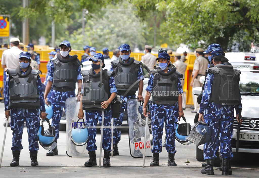 Manish Swarup Indian policemen stand guard at farmers protest site in New Delhi, India, Thursday, July 22, 2021. More than 200 farmers on Thursday began a protest near India's Parliament to mark eight months of their agitation against new agricultural laws that they say will devastate their income. (AP Photo/Manish Swarup)