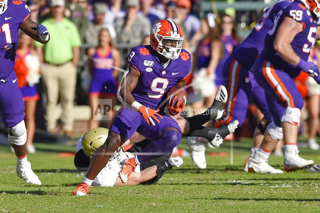 Richard Shiro Clemson's Travis Etienne (9) rushes for a touchdown during the first half of an NCAA college football game against Wofford, Saturday, Nov. 2, 2019, in Clemson, S.C. (AP Photo/Richard Shiro)