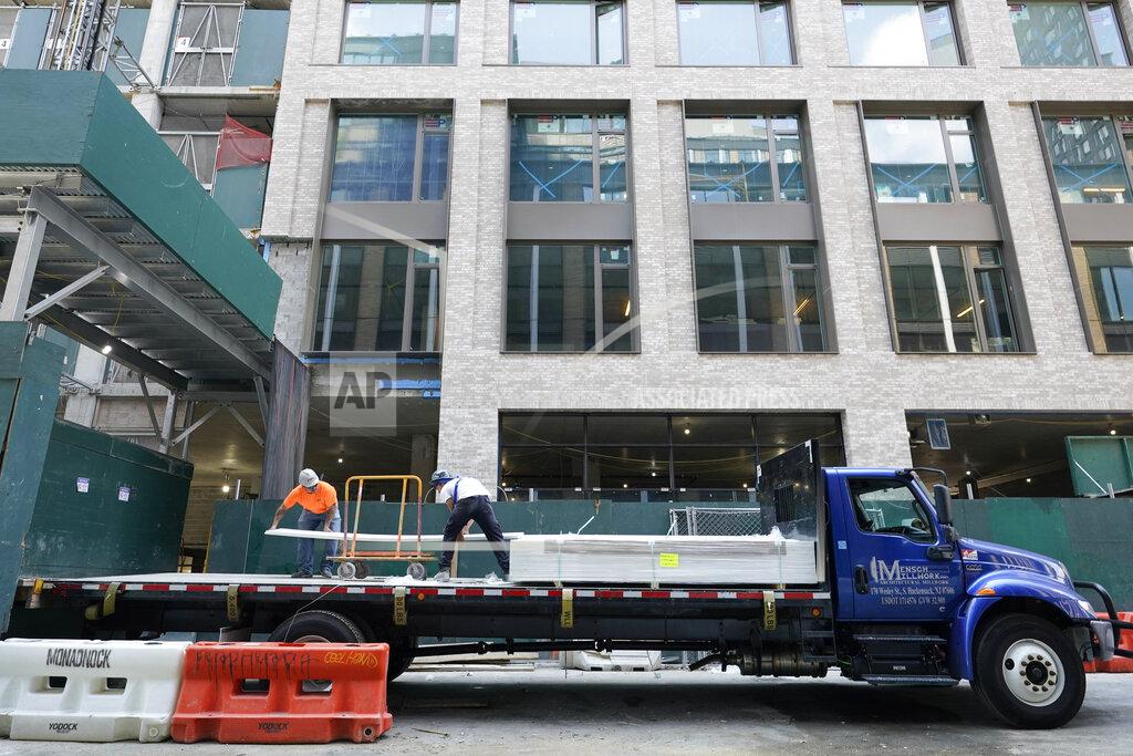 Mary Altaffer Construction workers unload sheet rock at a residential and commercial building under construction at the Essex Crossing development on the Lower East Side of Manhattan, Thursday, Aug. 4, 2022. On Friday, Aug. 5, the Labor Department delivers its July jobs report. (AP Photo/Mary Altaffer)