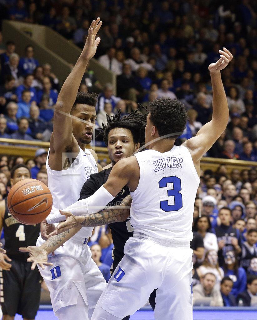 Gerry Broome Duke's Javin DeLaurier, left, and Tre Jones (3) guard Wake Forest's Sharone Wright Jr. during the first half of an NCAA college basketball game in Durham, N.C., Tuesday, March 5, 2019. (AP Photo/Gerry Broome)
