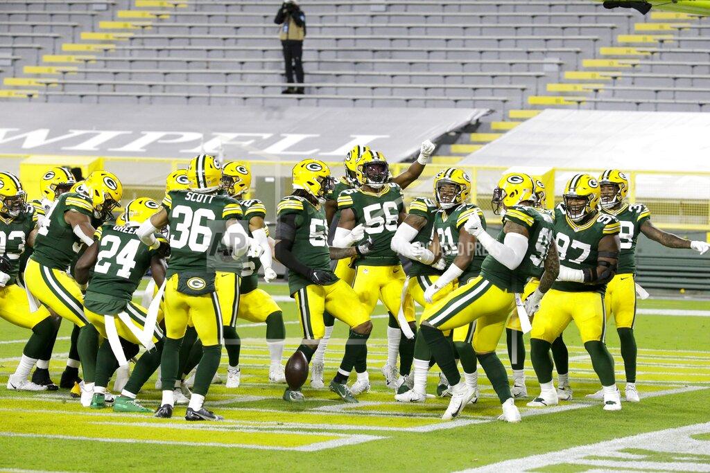 Mike Roemer Green Bay Packers players help Preston Smith celebrate his touchdown on a fumble recovery during the first half of an NFL football game against the Chicago Bears Sunday, Nov. 29, 2020, in Green Bay, Wis. (AP Photo/Mike Roemer)
