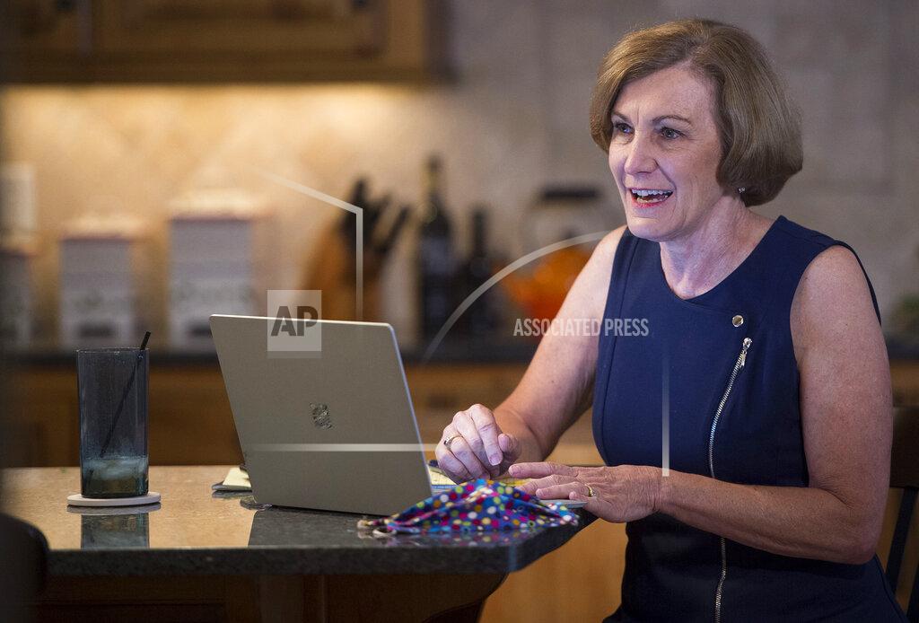Tammy Ljungblad Senator Barbara Bollier, a Democrat representing Kansas District 7, works on her re-election campaign from her home, July 20, 2020, in Mission Hills, Kan. The likely Democratic nominee for U.S. Senate, Bollier, 62, a retired anesthesiologist, promises to be a "voice of reason" in Washington. (Tammy Ljungblad/The Kansas City Star via AP)