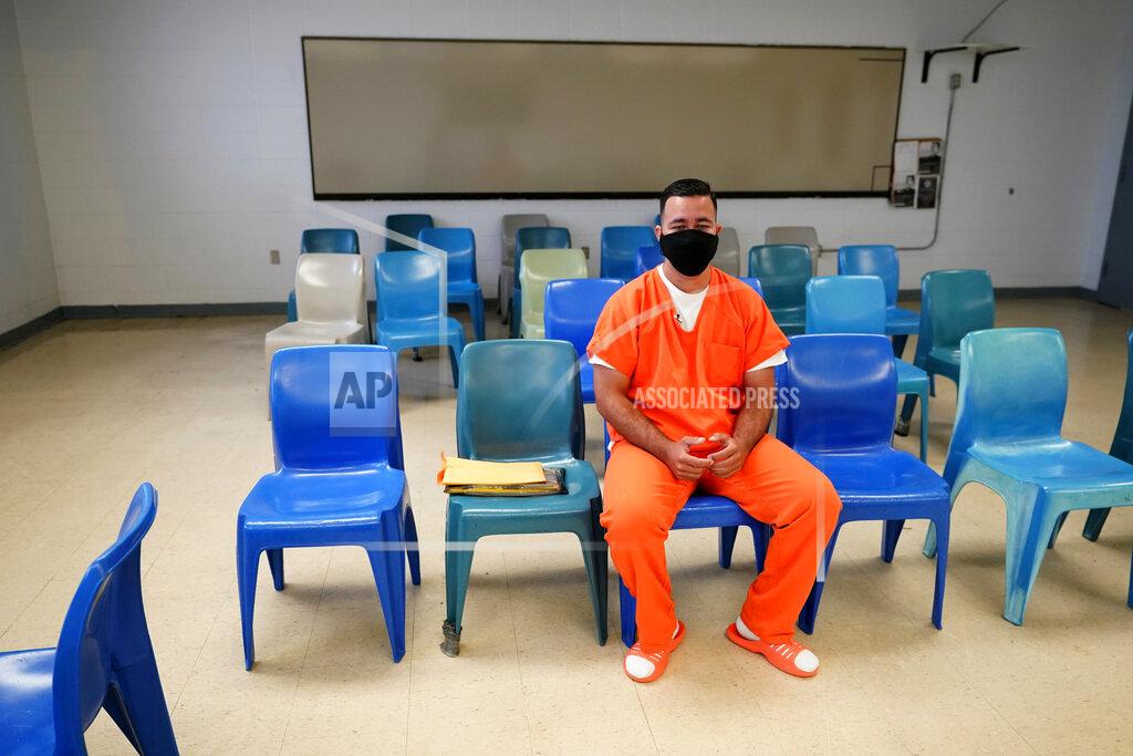 Gerald Herbert Immigration detainee Alexander Martinez speaks during an interview with The Associated Press inside the Winn Correctional Center in Winnfield, La., Friday, July 30, 2021. Martinez says he fled from homophobia, government persecution and the notorious MS-13 gang in El Salvador only to run into abuse and harassment in America’s immigration detention system. (AP Photo/Gerald Herbert)