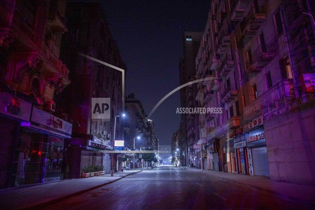 Nariman El-Mofty FILE - In this March 29, 2020 file photo, a street is empty during curfew hours due to the coronavirus outbreak, in Cairo, Egypt. Even as Egyptian authorities fight the swelling coronavirus outbreak, security agencies have tried to stifle criticism about the handling of the health crisis by the government of President Abdel Fattah el-Sissi. Rights groups say at least 10 doctors and six journalists have been arrested since the virus first hit Egypt. (AP Photo/Nariman El-Mofty, File)