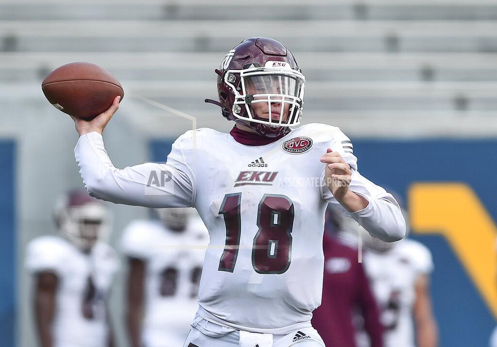 William Wotring Eastern Kentucky quarterback Parker McKinney (18) throws a pass against West Virginia during an NCAA college football game on Saturday, Sept. 12, 2020, in Morgantown, W.Va. (William Wotring/The Dominion-Post via AP)