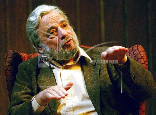 FILE - Composer and lyricist Stephen Sondheim gestures during a gathering at Tufts University in Medford, Mass., on April 12, 2004. Sondheim, the songwriter who reshaped the American musical theater in the second half of the 20th century, has died at age 91. Sondheim's death was announced by his Texas-based attorney, Rick Pappas, who told The New York Times the composer died Friday, Nov. 26, 2021, at his home in Roxbury, Conn. (AP Photo/Charles Krupa, File)