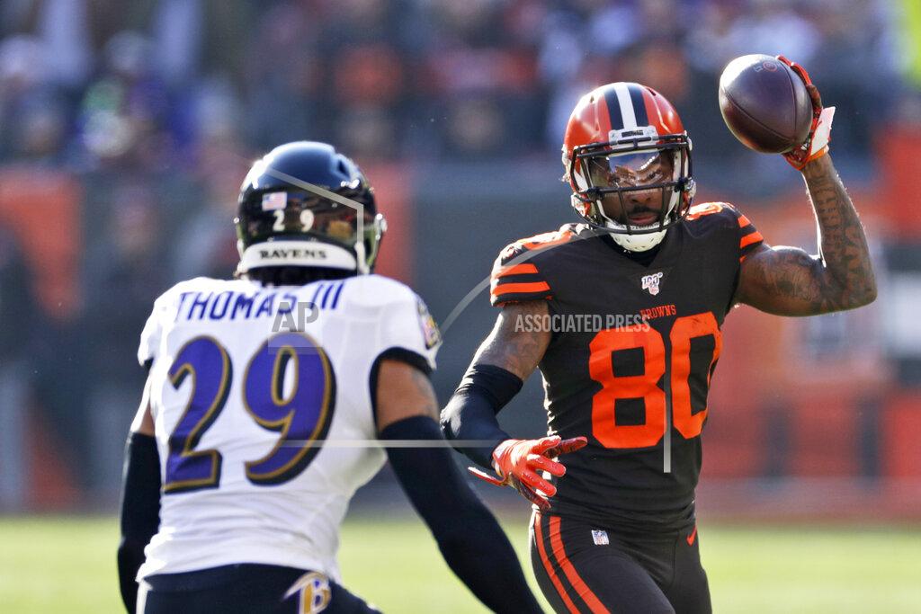 Ron Schwane FILE - In this Dec. 22. 2019, file photo, Cleveland Browns wide receiver Jarvis Landry (80) tries to avoid Baltimore Ravens free safety Earl Thomas (29) during the first half of an NFL football game in Cleveland. Landry has been placed on the active/physically unable to perform list following offseason hip surgery. The team made the roster move Sunday, Aug. 2, 2020, while stressing that Landry remains on schedule to return this season. (AP Photo/Ron Schwane, File)