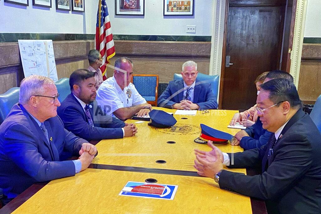 Uncredited In this photo provided by Office of Philippine Consul-General Elmer Cato, Philippine Consul-General Elmer Cato, right, talks with Philadelphia Mayor Jim Kenney, left, at the Philadelphia City hall, PA., on Tuesday June 21, 2022. The mayor of Philadelphia expressed shock and sorrow over the killing of a Filipino lawyer who was shot in the city over the weekend and is offering a $20,000 reward for information that will lead to the arrest of the shooter, Cato said Wednesday. (Office of Philippine Consul-General Elmer Cato via AP)