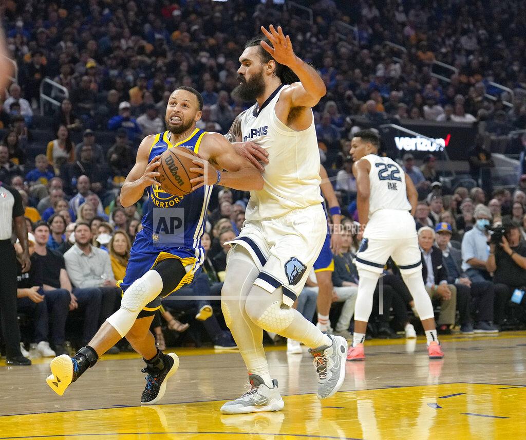Tony Avelar Golden State Warriors guard Stephen Curry drives to the basket against Memphis Grizzlies center Steven Adams during the first half of Game 6 of an NBA basketball Western Conference playoff semifinal in San Francisco, Friday, May 13, 2022. (AP Photo/Tony Avelar)