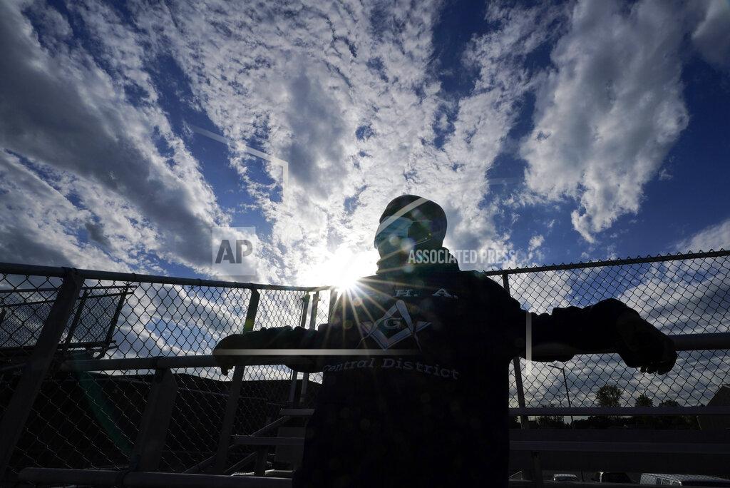Darron Cummings Larry Brown, 45, watches as his daughter plays a soccer game, Wednesday, Sept. 30, 2020, in Indianapolis. Brown spent about 80 days in an Indianapolis hospital this spring, fighting COVID-19 and nearly dying. His journey since returning home in June has been filled with unknowns. (AP Photo/Darron Cummings)