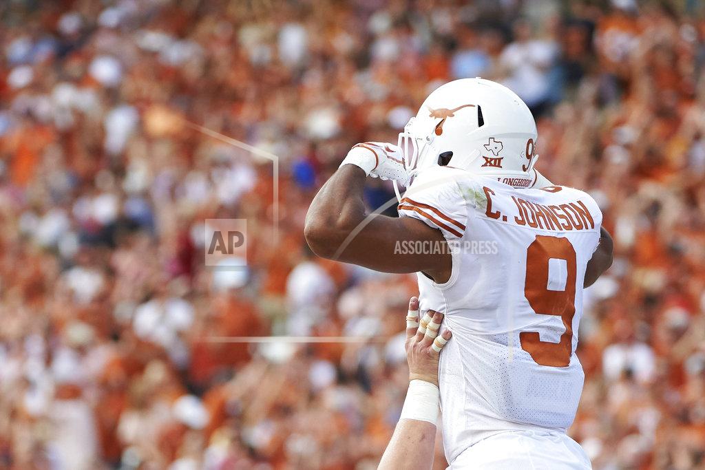 Cooper Neill Texas wide receiver Collin Johnson (9) celebrates after scoring a touchdown on a 2-yard reception against Oklahoma during the first half of an NCAA college football game at the Cotton Bowl, Saturday, Oct. 6, 2018, in Dallas. (AP Photo/Cooper Neill)
