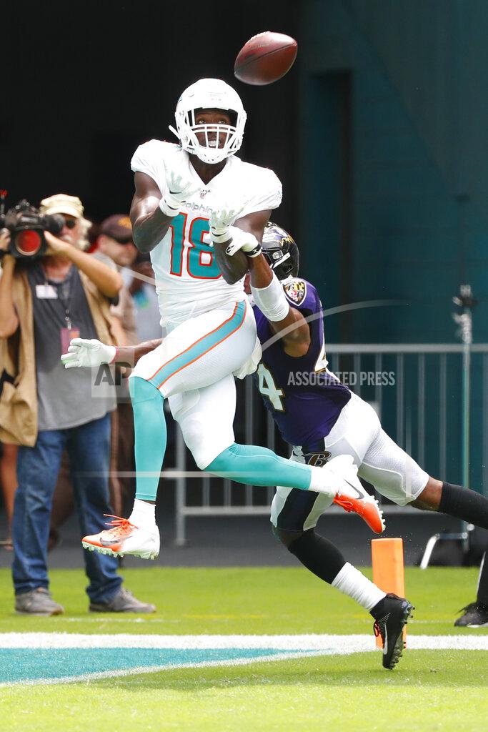 Wilfredo Lee Miami Dolphins wide receiver Preston Williams (18) eyes a pass as Baltimore Ravens cornerback Marlon Humphrey (44) defends, during the first half at an NFL football game, Sunday, Sept. 8, 2019, in Miami Gardens, Fla. (AP Photo/Wilfredo Lee)