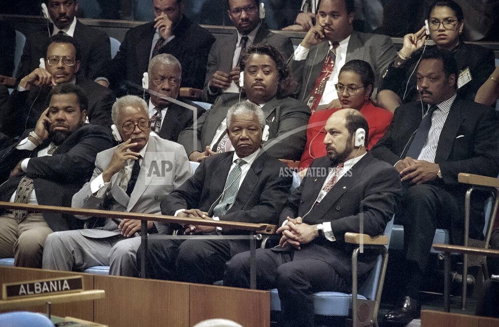 Bebeto Matthews FILE - In this Sept. 23, 1993, file photo, civil rights activists the Rev. Al Sharpton, second row center, and the Rev. Jesse Jackson, second row right, and New York Mayor David Dinkins, second from left front, are among supporters joining African National Congress President Nelson Mandela, second from right in front, during his visit to the United Nations General Assembly. When Sharpton was 13, Jackson appointed him to be the youth director of New York's Operation Breadbasket. For more than three decades, Sharpton, 65, has been a go-to advocate for Black American families seeking justice and peace in the wake of violence and countless incidents that highlight systemic racism. (AP Photo/Bebeto Matthews, File)
