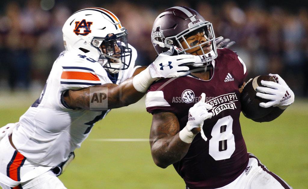 Rogelio V. Solis Mississippi State running back Kylin Hill (8) breaks away from a attempted tackle by Auburn linebacker Darrell Williams (49) as he runs for a first down during the first half of their NCAA college football game in Starkville, Miss., Saturday, Oct. 6 2018. (AP Photo/Rogelio V. Solis)