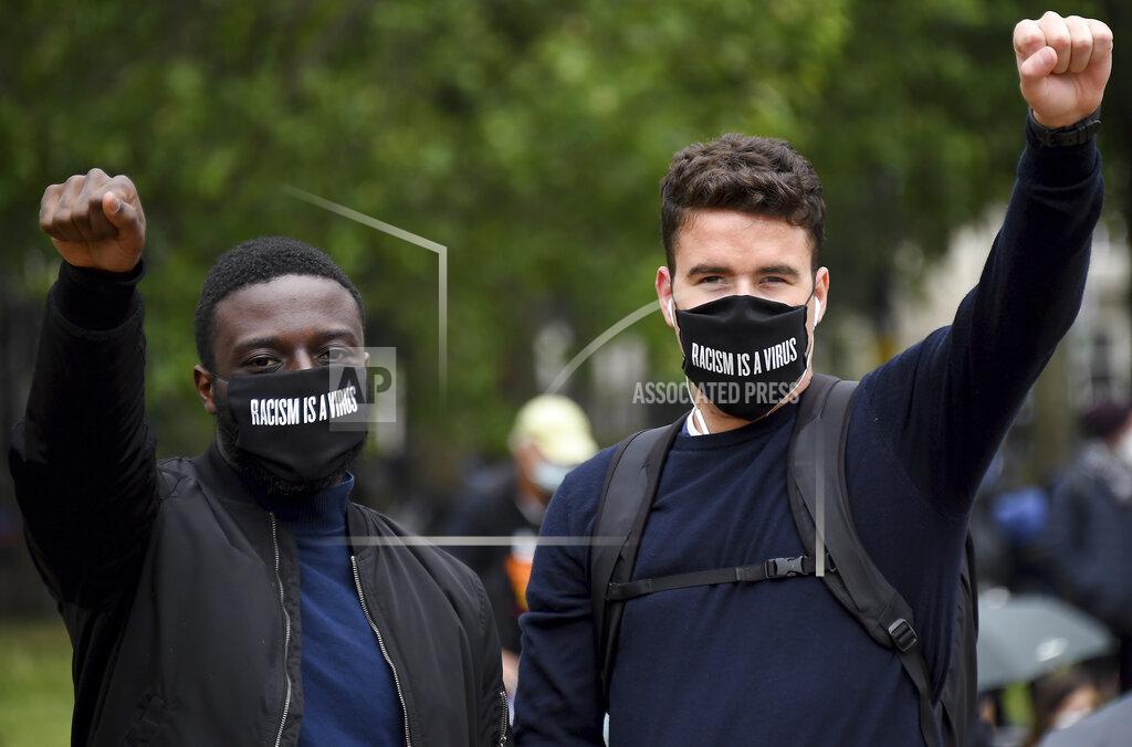 Alberto Pezzali Protestors make a fist during protests in London, Friday, June 12, 2020 in response to the recent killing of George Floyd by police officers in Minneapolis, USA, that has led to protests in many countries and across the US.(AP Photo/Alberto Pezzali)