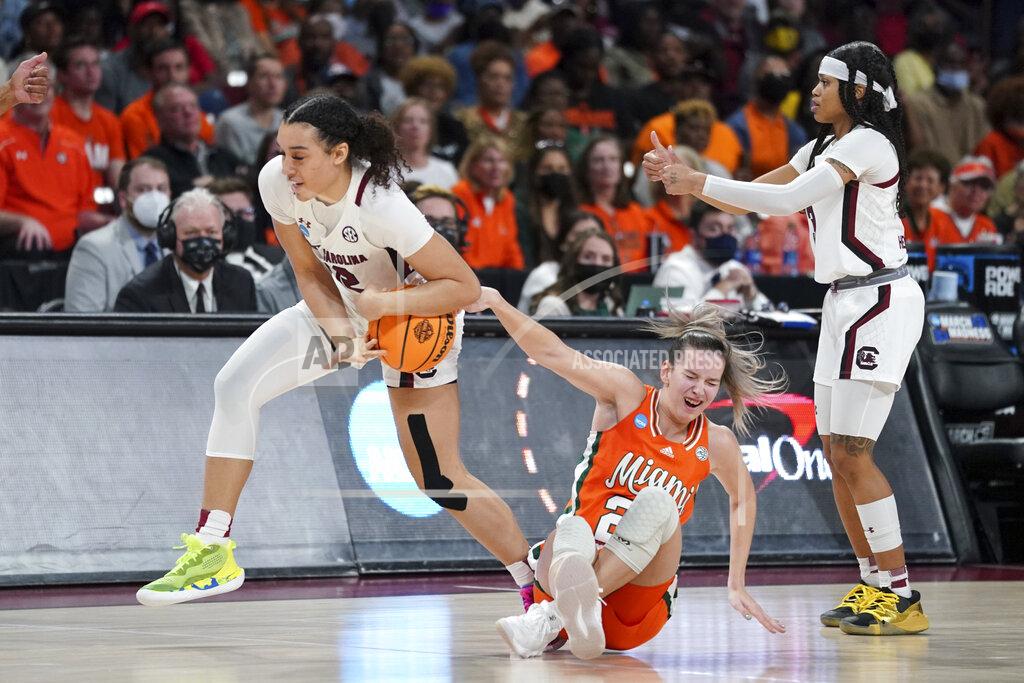 Sean Rayford South Carolina guard Brea Beal (12) forces a held ball against Miami guard Karla Erjavec, on floor, during the second half of a second-round game in the NCAA college basketball tournament, Sunday, March 20, 2022, in Columbia, S.C. South Carolina won 49-33. (AP Photo/Sean Rayford)