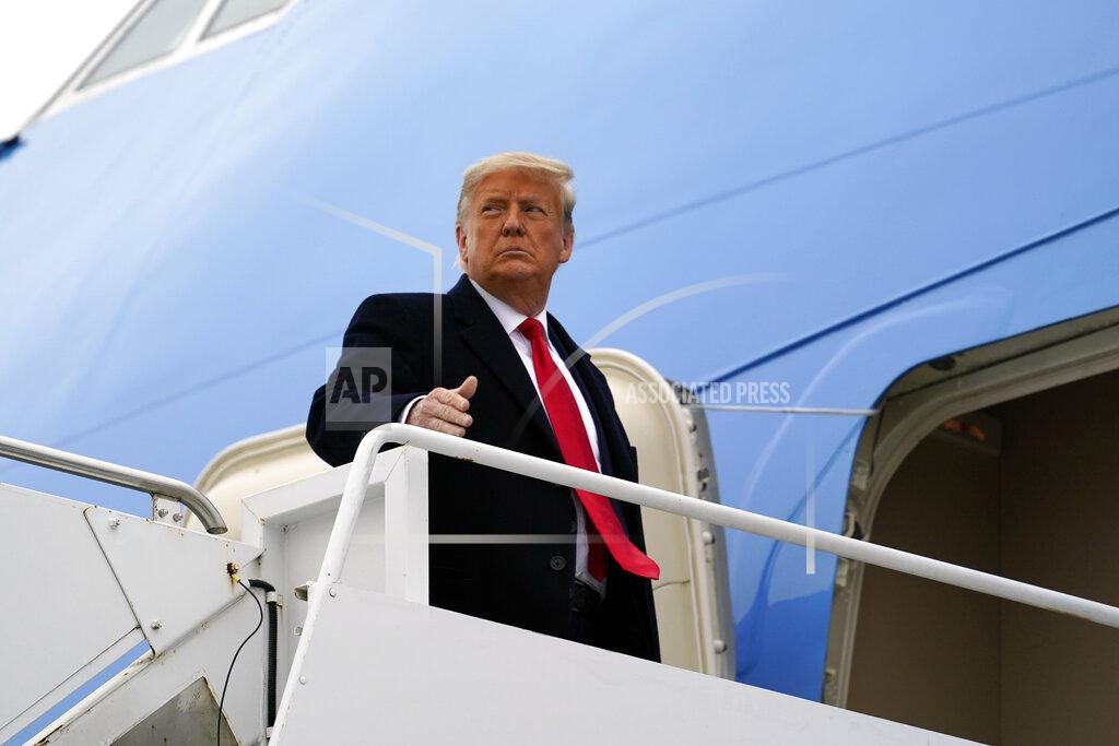 Alex Brandon FILE - In this Tuesday, Jan. 12, 2021 file photo, President Donald Trump gestures as he boards Air Force One upon arrival at Valley International Airport, in Harlingen, Texas. Iran on Tuesday, Jan. 19, 2021, imposed sanctions on President Donald Trump and a number of members of his administration over their alleged role in support of “terrorism," according to the foreign ministry website. (AP Photo/Alex Brandon, File)