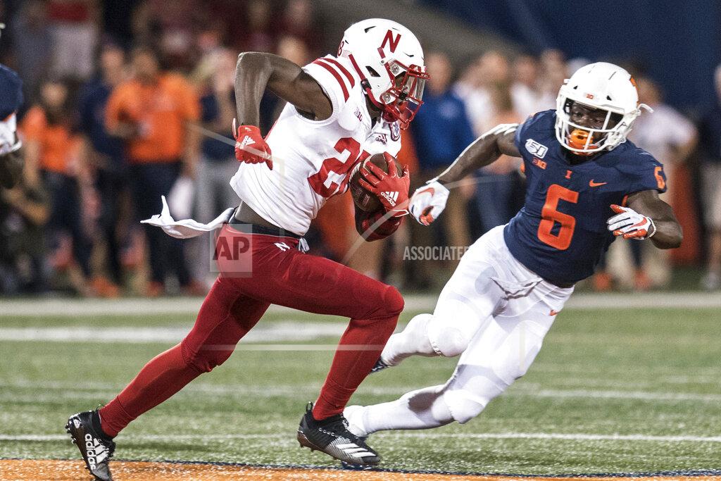 Holly Hart Nebraska's Maurice Washington (28) runs with the ball as Illinois' Tony Adams (6) defends in the first half of an NCAA college football game, Saturday, Sept. 21, 2019, in Champaign, Ill. (AP Photo/Holly Hart)