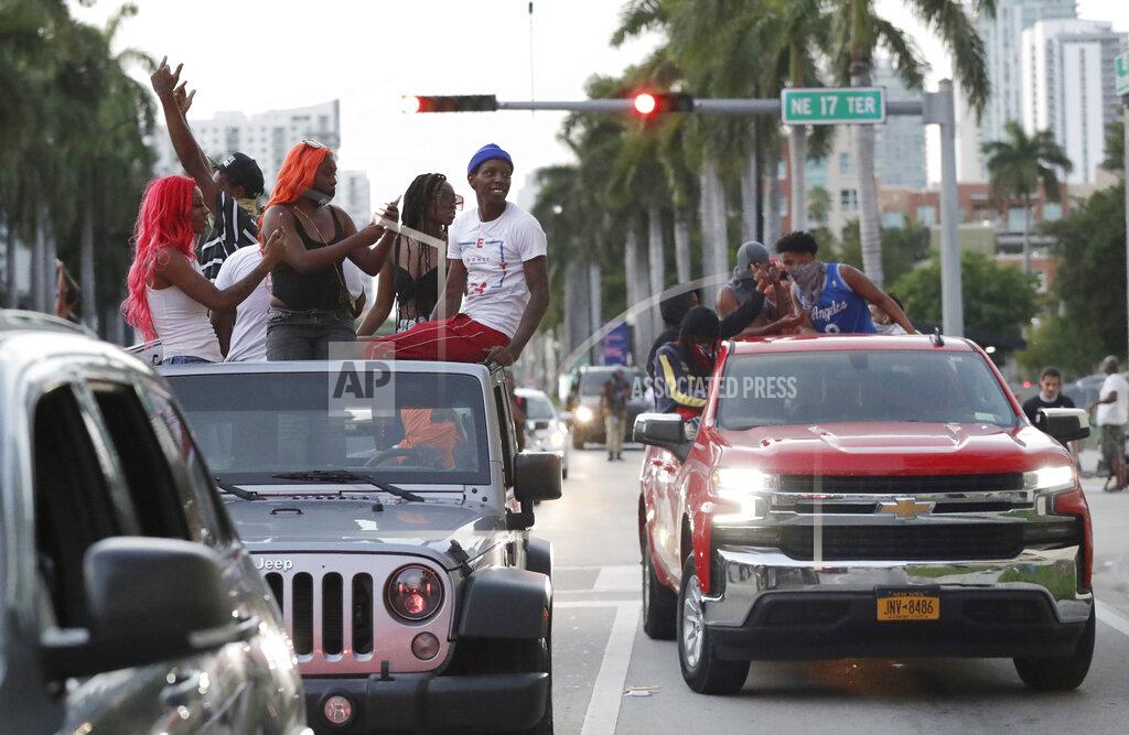 Wilfredo Lee Protesters against the death of George Floyd ride in their cars as they demonstrate Sunday, May 31, 2020, in Miami. Floyd died after being restrained by Minneapolis police officers on May 25.(AP Photo/Wilfredo Lee)
