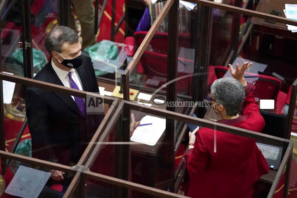 Julio Cortez Maryland Sen. Cheryl Kagan, right, D-Montgomery County, and Sen. Brian Feldman, D-Montgomery County, are separated by plexiglass barriers while talking before the start of the state's 2021 legislative session, Wednesday, Jan. 13, 2021, in Annapolis, Md. (AP Photo/Julio Cortez)
