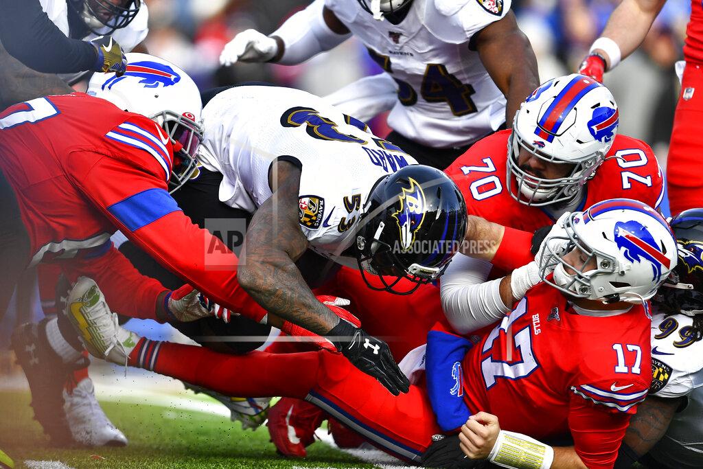 Adrian Kraus Buffalo Bills quarterback Josh Allen (17) has the ball knocked loose as he is hit by Baltimore Ravens outside linebacker Matt Judon (99), right, during the first half of an NFL football game in Orchard Park, N.Y., Sunday, Dec. 8, 2019. The fumble was recovered by Ravens defensive end Jihad Ward (53). (AP Photo/Adrian Kraus)