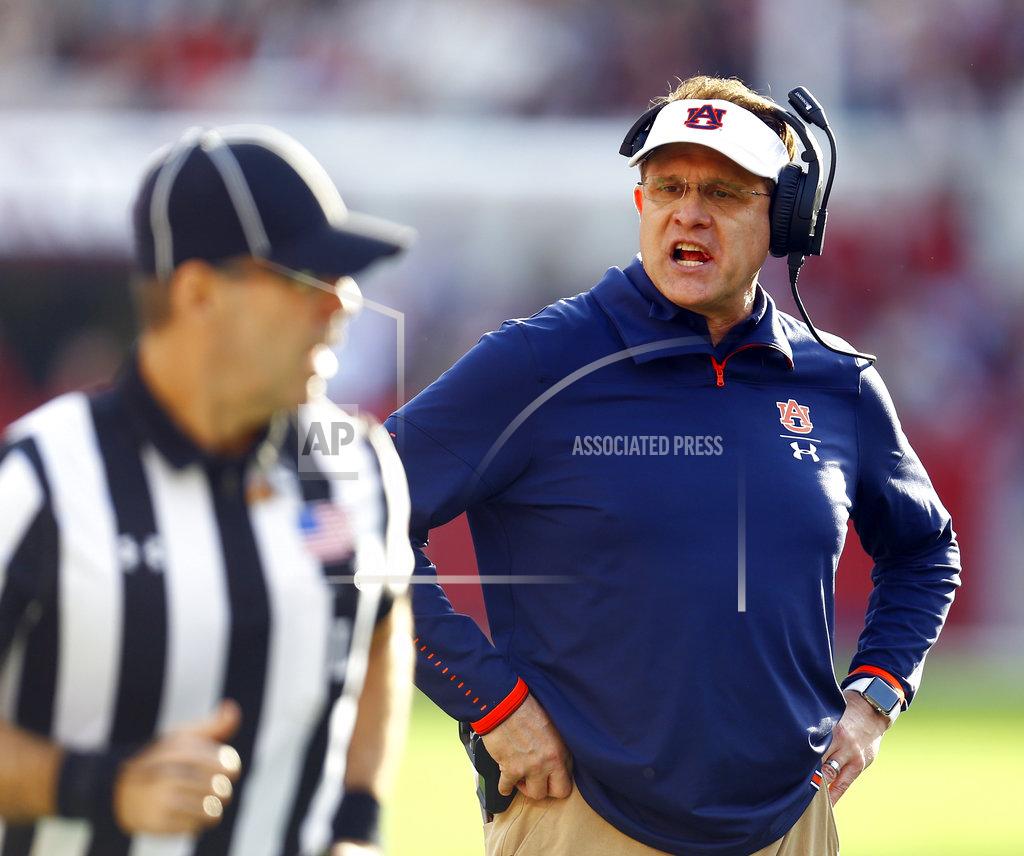 Butch Dill Auburn head coach Gus Malzahn, right, reacts after getting a penalty called on him during the first half of an NCAA college football game against Alabama, Saturday, Nov. 24, 2018, in Tuscaloosa, Ala. (AP Photo/Butch Dill)