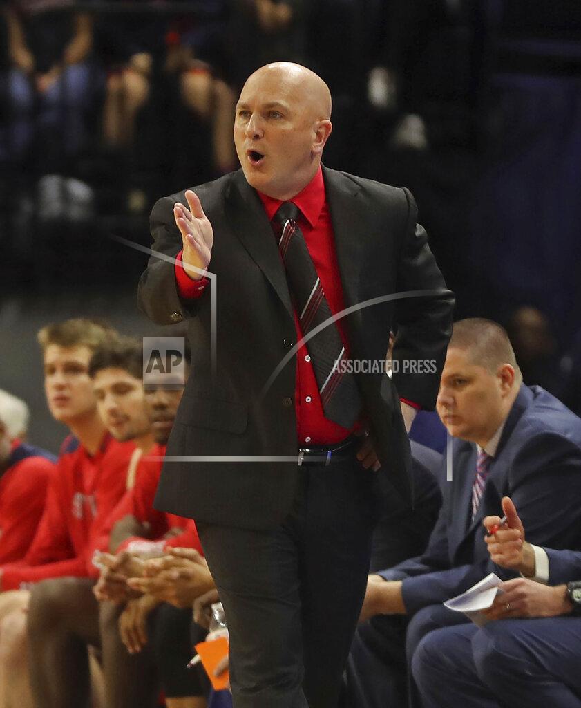 Andrew Shurtleff Stony Brook coach Geno Ford reacts to a play during the team's NCAA college basketball game against Virginia in Charlottesville, Va., Wednesday, Dec. 18, 2019. (AP Photo/Andrew Shurtleff)