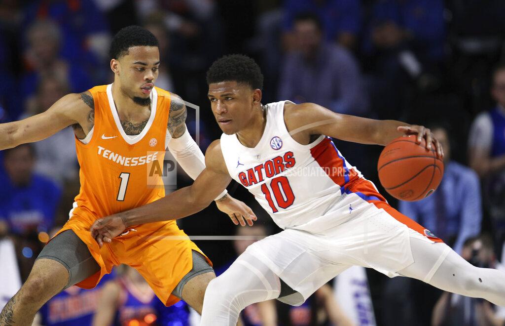 Matt Stamey Florida guard Noah Locke (10) is defended by Tennessee guard Lamonte Turner (1) during the first half of an NCAA college basketball game Saturday, Jan. 12, 2019, in Gainesville, Fla. (AP Photo/Matt Stamey)