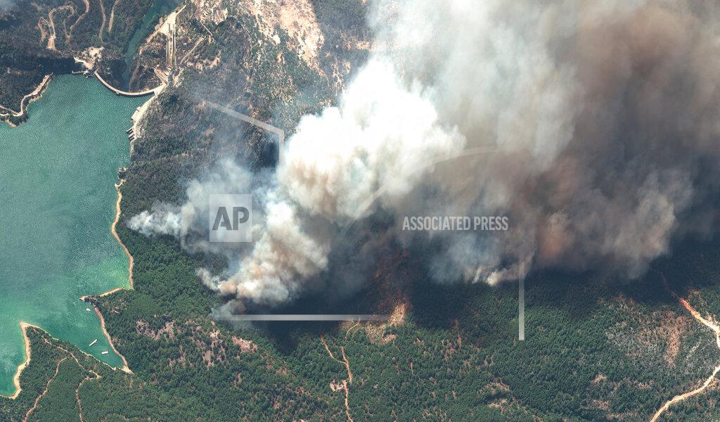 Satellite Image ©2021 Maxar Technologies In this image provided by Maxar, a satellite view of smoke rising from wildfires near Oymapinar Dam, southern Turkey, on Thursday July 29, 2021. Turkish fire crews are continuing to fight deadly blazes in southern Turkey that have burned down homes and forced many evacuations. (Satellite image ©2021 Maxar Technologies via AP)