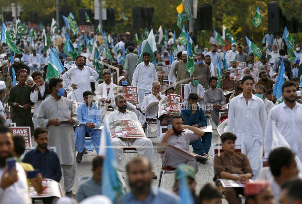 Anjum Naveed Supporters of a religious group Jamaat-e-Islami take part in a rally to show solidarity with the Kashmiri people on the eve of first anniversary of India's decision to revoke the disputed region's semi-autonomy, in Islamabad, Pakistan, Wednesday, Aug. 5, 2020. Last year on Aug. 5, India's Hindu-nationalist-led government of Prime Minister Narendra Modi stripped Jammu and Kashmir's statehood, scrapped its separate constitution and removed inherited protections on land and jobs. (AP Photo/Anjum Naveed)