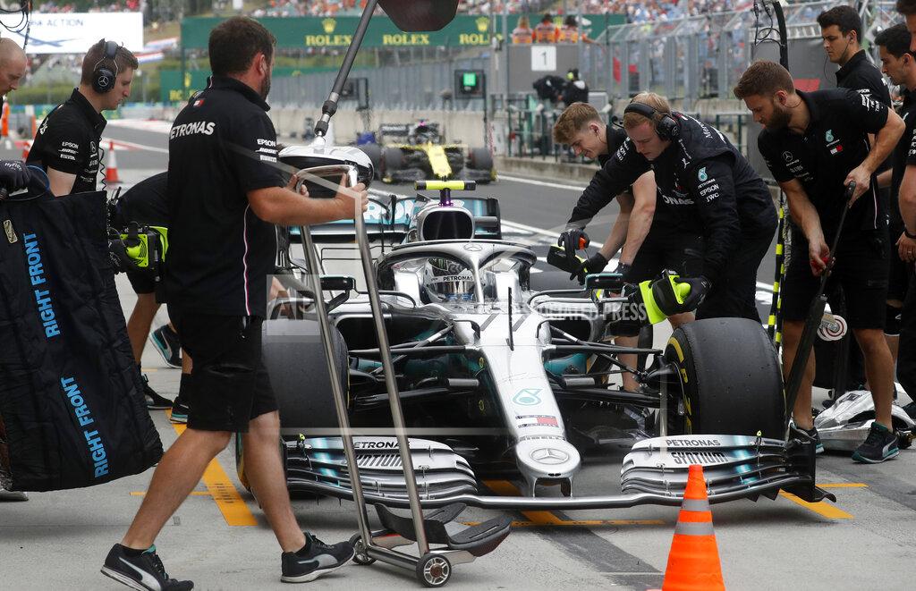 Laszlo Balogh FILE - In this file photo dated Friday, Aug. 2, 2019, Pit crew work on the car of Mercedes driver Valtteri Bottas of Finland during the second practice session of the Hungarian Formula One Grand Prix at the Hungaroring racetrack in Mogyorod, northeast of Budapest, Hungary. The British-based Mercedes team announced Thursday Aug. 29, 2019, it has exercised the option to keep 30-year-old Finnish driver Bottas for the 2020 season, as teammate of world champion Lewis Hamilton. (AP Photo/Laszlo Balogh, FILE)