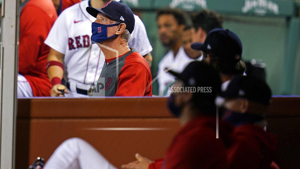 Charles Krupa Boston Red Sox manager Ron Roenicke stands in the dugout during the ninth inning of the team's baseball game against the Baltimore Orioles at Fenway Park in Boston, Thursday, Sept. 24, 2020. (AP Photo/Charles Krupa)