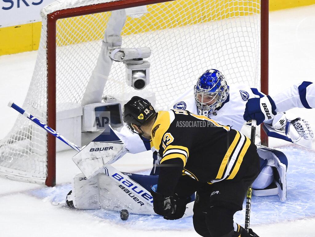Nathan Denette Tampa Bay Lightning goaltender Andrei Vasilevskiy (88) makes a save against Boston Bruins center Charlie Coyle (13) during the first period of an NHL hockey playoff game Wednesday, Aug. 5, 2020 in Toronto. (Nathan Denette/The Canadian Press via AP)