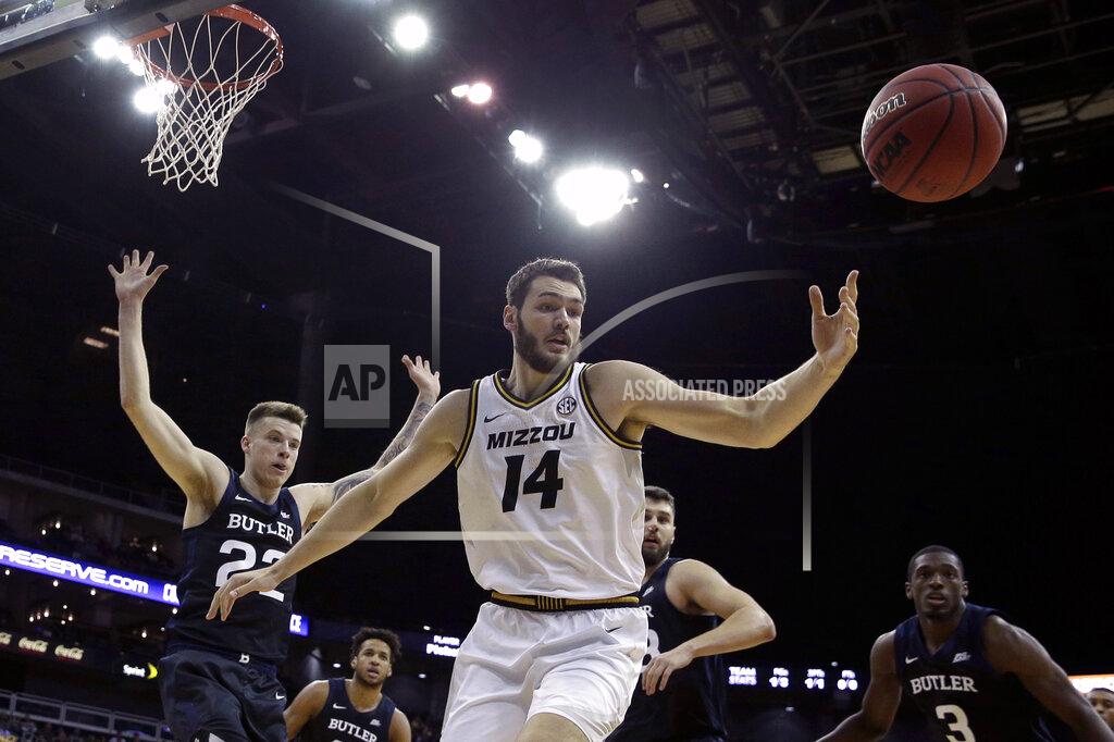 Charlie Riedel Missouri forward Reed Nikko (14) chases a rebound during the first half of an NCAA college basketball game against Butler, Monday, Nov. 25, 2019, in Kansas City, Mo. (AP Photo/Charlie Riedel)