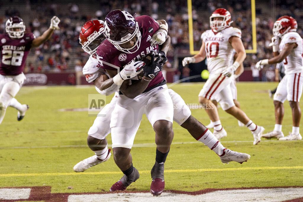 Sam Craft Texas A&M tight end Jalen Wydermyer (85) catches a pass for a touchdown as Arkansas defensive back Joe Foucha defends during the second half of an NCAA college football game Saturday, Oct. 31, 2020, in College Station, Texas. (AP Photo/Sam Craft)